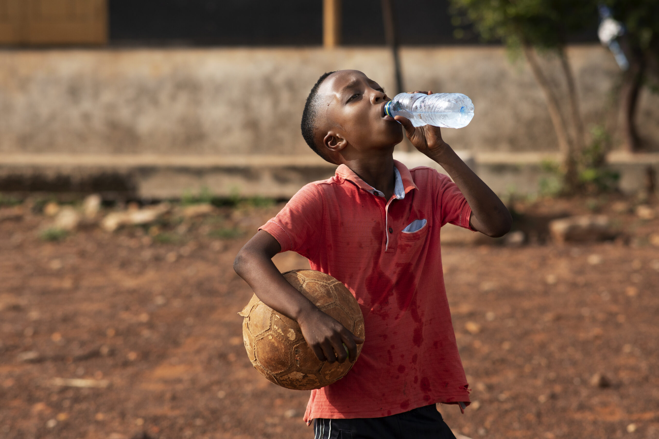 medium-shot-boy-drinking-water